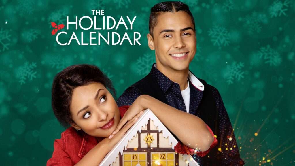 Poster for The Holiday Calendar featuring a woman leaning her chin on a wooden advent calendar shaped like a house, looking up playfully. Beside her stands a smiling man with his arm resting on the calendar. The background is a teal-green color filled with softly blurred snowflakes, and the title appears above them in white lettering with a small holly graphic